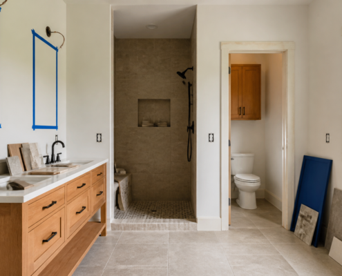 Bathroom remodel planning with shower layout, vanity placement, and tile samples.
