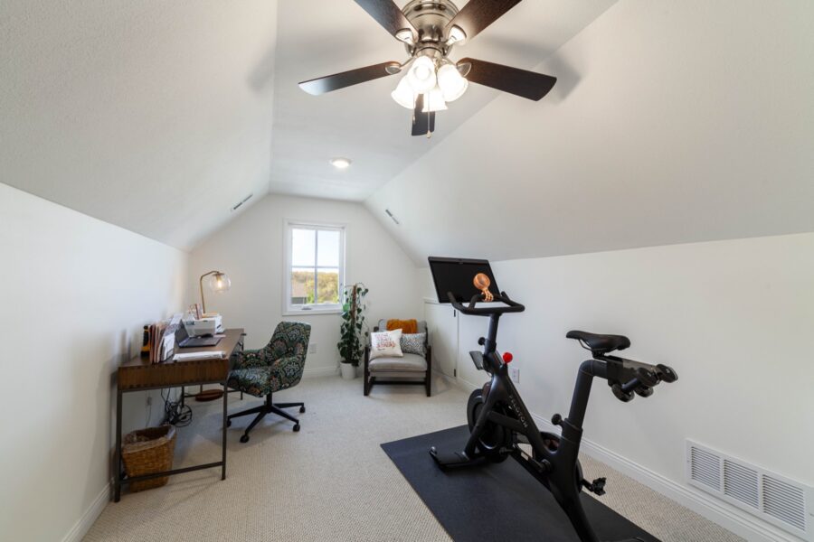Finished attic room set up as an office and home gym